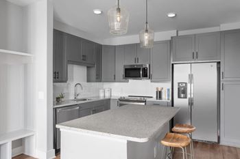 Large kitchen island with granite countertops and large kitchen